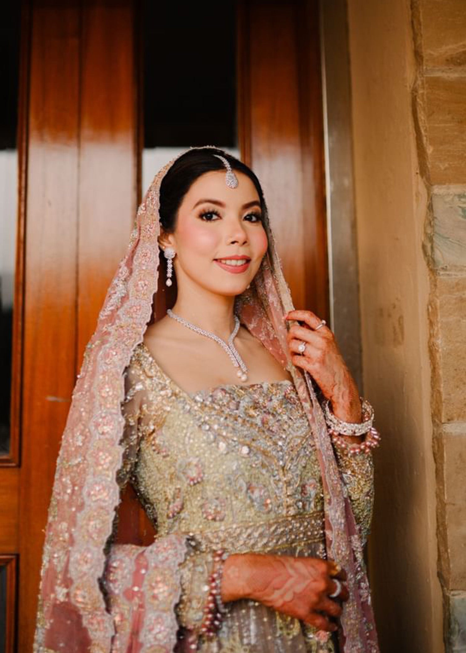 Pakistani Muted Gold Dusty Rose Embellished Bridal Lehenga (3-Piece) - Image 1