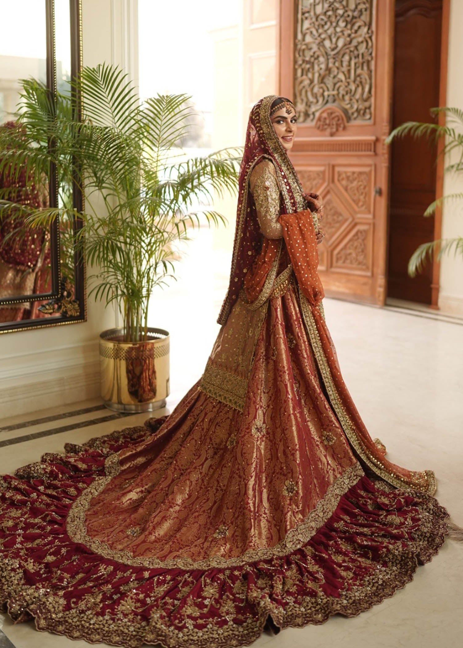 Pakistani Deep Maroon Rust Zardozi Velvet Brocade Bridal Lehenga (3-Piece) - Image 1