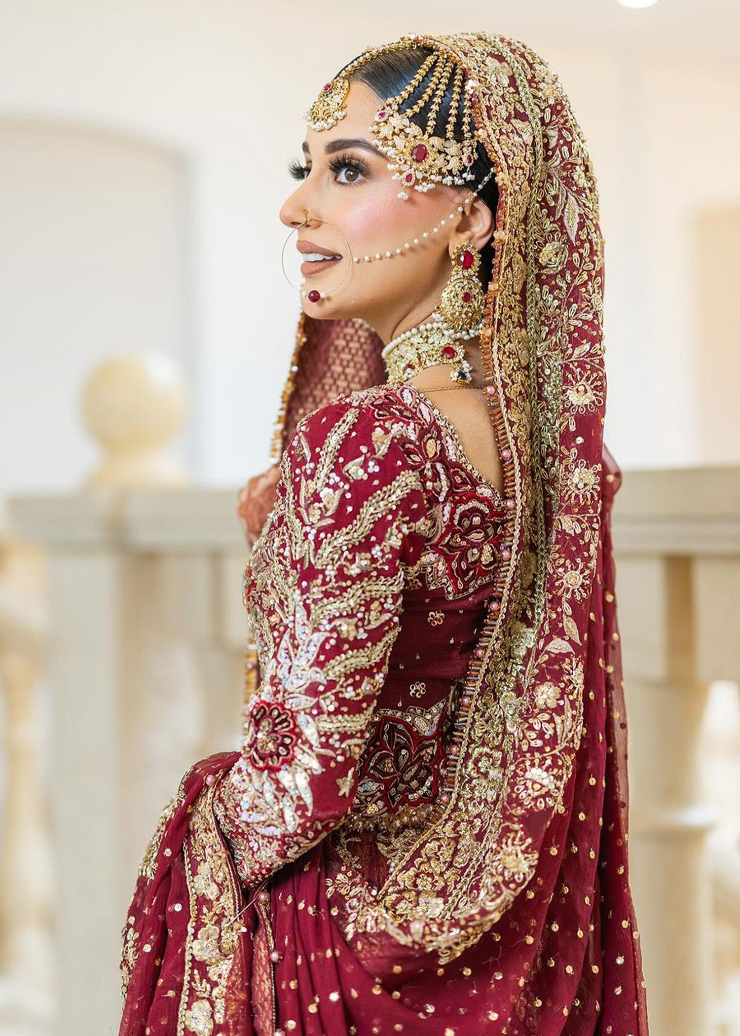 Pakistani Deep Maroon Embellished Net Bridal Lehenga (3-Piece) - Image 3