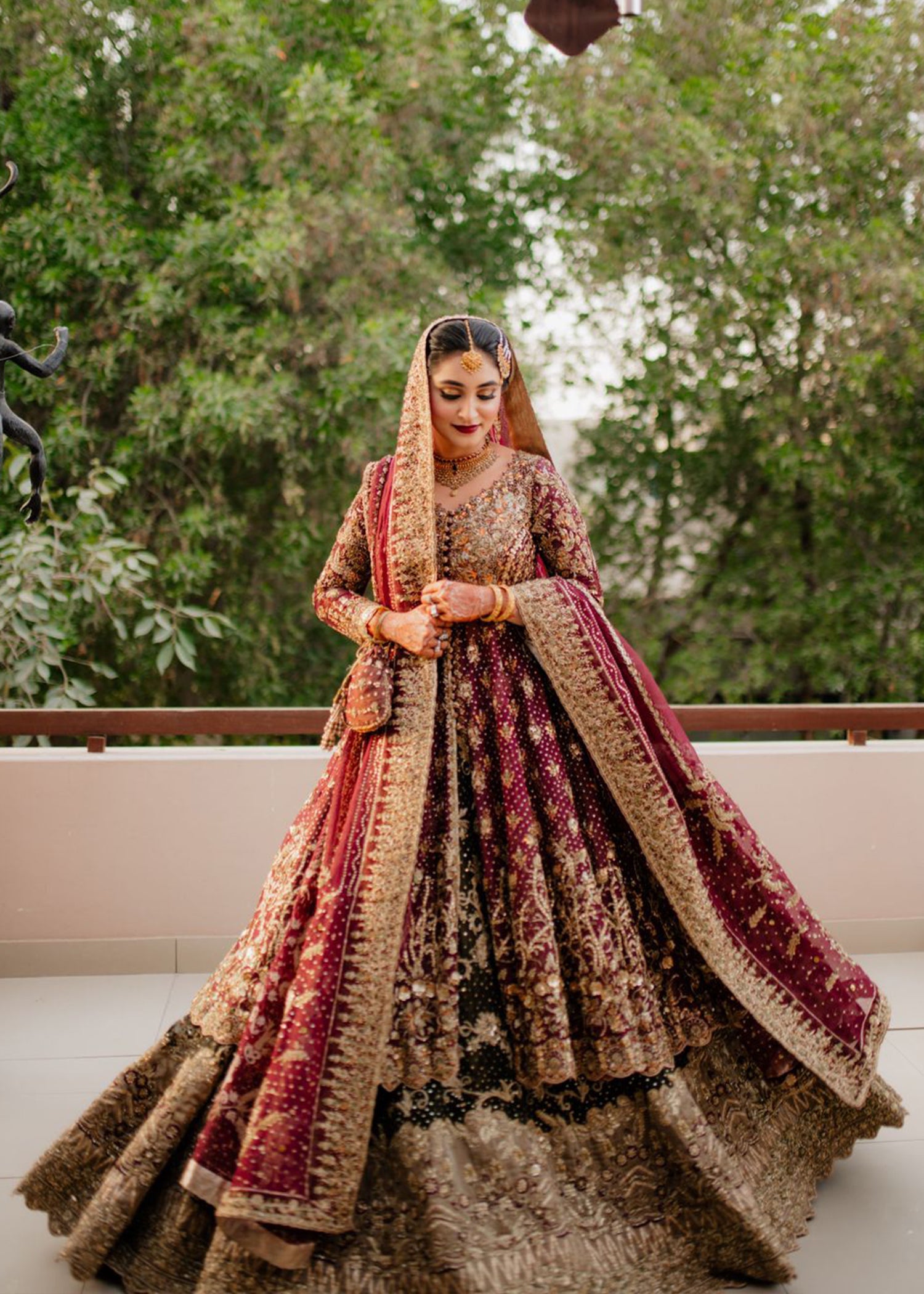 Pakistani Deep Maroon Gold Embroidered Velvet Bridal Lehenga (3-Piece) - Image 1