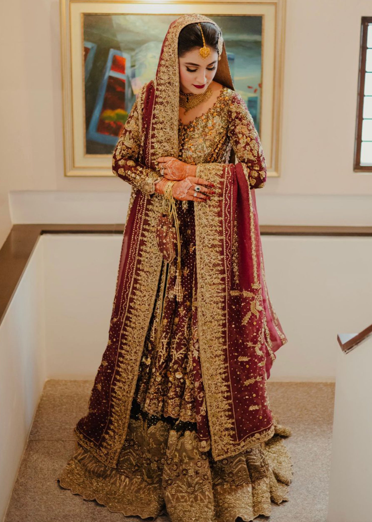 Pakistani Deep Maroon Gold Embroidered Velvet Bridal Lehenga (3-Piece) - Image 2