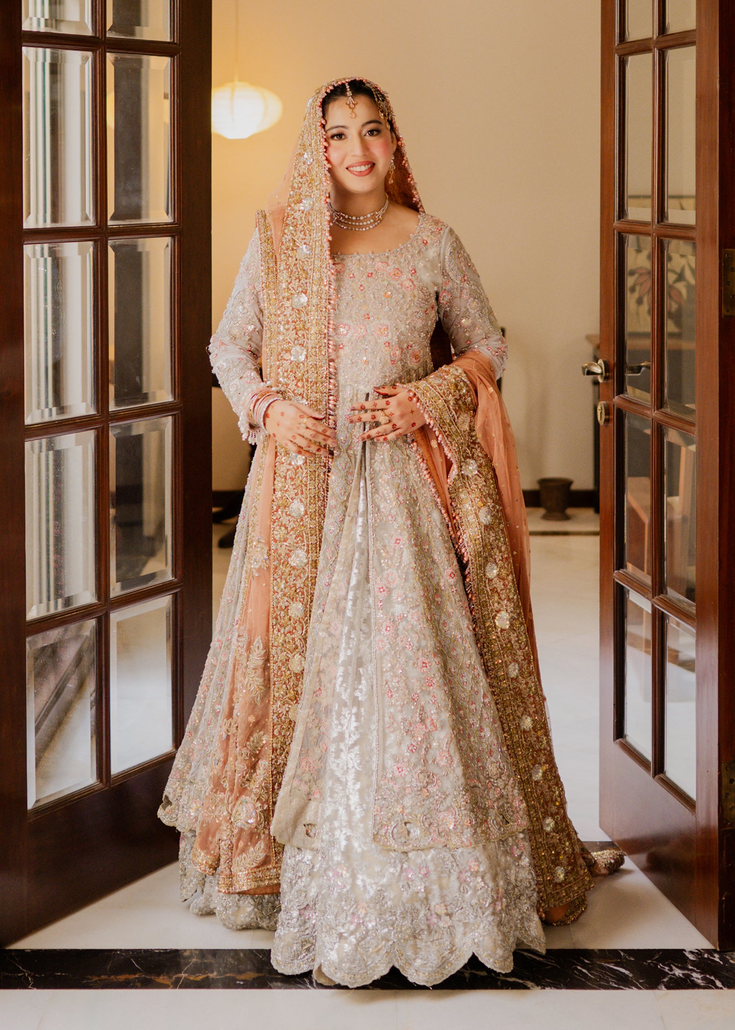 Pakistani Soft Silver Peach Embellished Net Bridal Lehenga (3-Piece) - Image 1